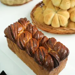 This beautifully braided chocolate leopard loaf is one of the bonus recipes we share. It shows how you can get creative with shaping and filling to make stunning artisan breads at home.