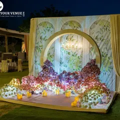 A stunning floral photo backdrop for the reception. I used a sea of flowers in shades of purple, pink, and white to create this magnificent installation, set against a classic floral-print background.