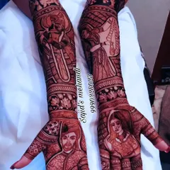 A classic example of my portrait artistry. This design features a beautifully shaded bride and groom on the palms, surrounded by intricate patterns and storytelling elements like a doli (palanquin) scene on the forearms.