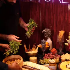 Our team members preparing the grazing table at the AOM Couture influencer event. We were thrilled to partner with the fabulous fashion brand for their special evening.