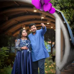 A beautiful floral navy blue satin gown, perfect for a maternity shoot or an evening function. The satin gives it a lovely sheen.