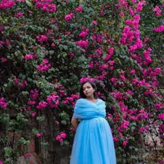 The contrast of this light blue tulle maternity gown against a wall of bright pink bougainvillea creates such a beautiful, dreamy photo. This gown is lightweight and comfortable for outdoor shoots.