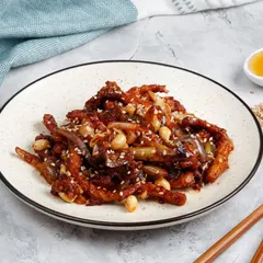 A closer look at our Honey Chicken with Peanuts, showing the glossy sauce coating each piece of crispy chicken.