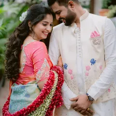 In a quiet moment together, Gayatri and Saurabh share a smile that speaks volumes. The soft light and natural setting complement the elegance of their traditional engagement attire.
