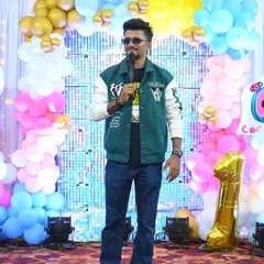 Hosting a birthday party, making sure the energy is always high.