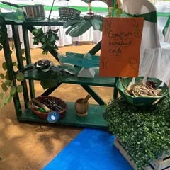 Welcome to the Gruffalo Woodland Cafe. For this book-themed party, I created a pretend play kitchen with natural materials like twigs, leaves, and pinecones for children to make their own woodland creations.