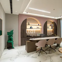 This modern office redefines the workspace with a fusion of texture, form, and color. We used soft pink arched niches, sleek finishes, and warm lighting to create a contemporary aesthetic that is both professional and deeply personal.