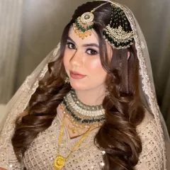Not every bride wants red, and I love creating these soft, dreamy looks. This bride's beautiful beige and green lehenga was complemented with a soft glam makeup look, featuring defined eyes and a subtle nude-pink lip. The final look with the dupatta setting was just Mashallah.