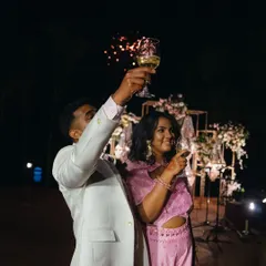 A toast to their future, with fireworks in the background. We planned this moment to create a spectacular end to the evening's formalities.