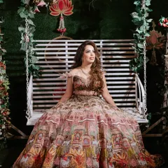 The full view of Nisha's unique printed lehenga. The makeup was kept glamorous yet balanced to let the outfit shine.
