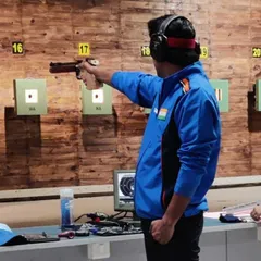 I believe in leading from the front. Here I am competing in the 10m Air Pistol event at the Karnataka State Meet, where I won a gold medal.