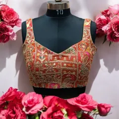 A designer blouse can instantly elevate your entire look. This piece, with its intricate multi-color embroidery, is a testament to my belief that a blouse isn't just an add-on; it's the hero of your outfit. It’s versatile enough to pair with many sarees and lehengas.