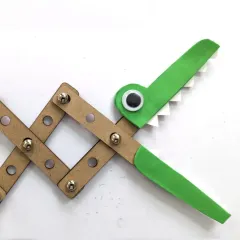A fun mechanical grabber made with laser-cut parts and fasteners. It's a simple yet effective demonstration of linkages and levers, a key concept in mechanical engineering.