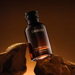 We placed this "Ombree" perfume bottle on rugged rocks with warm backlighting to evoke a sense of earthy, masculine strength and warmth.