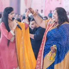 The joy of music is in sharing it. Here I am, interacting with a guest, dancing and singing along during the Ganpati Mahotsav. These are the moments that make every event special.