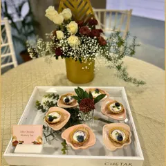 Our White Chocolate Blueberry Tarts are a picture of elegance. Served in a branded tray, these delicate tarts feature a buttery crust, creamy filling, and a fresh blueberry on top.