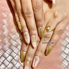 Nothing says celebration like a full set of gold glitter nails. This glamorous look uses a combination of fine and chunky glitter for maximum sparkle, perfect for a wedding reception, sangeet, or any festive party.