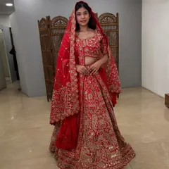 Feel like a queen in this stunning red bridal lehenga, available to rent at a fraction of its original price.