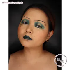 I love diving into the history of makeup, and this is my take on the 1920s "sad eye" look. I used droopy, dark eyeshadows, pencil-thin brows, and a defined cupid's bow lip to capture the dramatic and rebellious spirit of the era. This style is fantastic for period-themed photoshoots or character work.