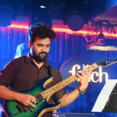 Our instructors are not just teachers but also active performers. This shot captures one of our guitar gurus during a live performance, bringing real-world experience and passion into every lesson they teach.