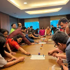 Team building should be fun, not forced. Here, the team at ICICI Venture is fully focused on a custom-designed game during their Diwali party. I bring in activities that encourage genuine interaction and teamwork, creating bonds that last beyond the event.