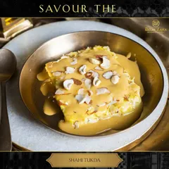 Savor the royal taste of our Shahi Tukda. Crispy fried bread is soaked in fragrant, sweetened milk (rabdi) and garnished with nuts for a truly decadent dessert.