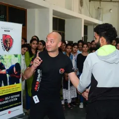 I am not a lone wolf, but part of a pack of professional hunters aiming to end the reign of fear. Here I am with my team during a university workshop.
