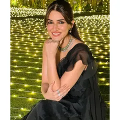 Kriti Sanon looking serene and beautiful, adorned with my mint-green floral choker set against a backdrop of fairy lights.