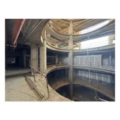 The multi-level atrium under construction at Sant Nirankari Hospital. These open corridors surrounding the central void foster a sense of connection and visibility, reinforcing the hospital's commitment to patient-centric care.