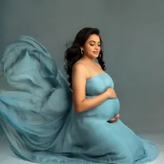 This beautiful blue gown is made of a light, airy material that drapes and flows wonderfully, creating a soft and dreamy effect on the studio floor.