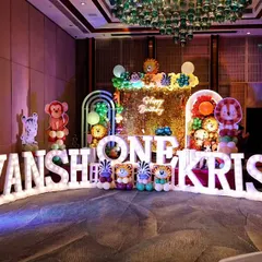 The grand decor for a first birthday party, featuring large, illuminated letters spelling out the children's names. We are experienced in capturing large-scale, elaborately themed events for kids.