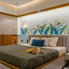 Your bedroom should be a peaceful retreat. For this master bedroom, I combined soft lighting, a custom-designed bed with a beautiful feature wall, and fluted paneling to create a space that feels both luxurious and relaxing.