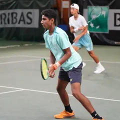 Tavish Pahwa competing at the U16 European Junior Tour Category 3 event in France. This image captures his focus during a doubles match, where he emerged as the champion, showcasing his adaptability on different surfaces.
