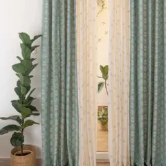 The Dahlia print in a soft sage green is paired with a Sapling Nile Blue sheer. This is a beautiful example of how to mix subtle patterns and colors for a harmonious, nature-inspired feel.