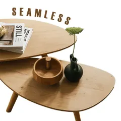 This image highlights the seamless design of the nested coffee tables. The smooth, curved edges and light wood finish create a soft, approachable look, making it a versatile addition to any modern living room.