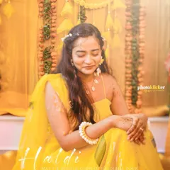 A serene portrait of the bride during her haldi ceremony, capturing a quiet moment of reflection amidst the vibrant celebrations.