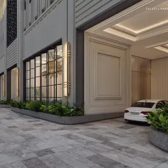 The driveway entrance to Empire Tower, offering a glimpse of the Art Deco-inspired grandeur within. The design uses vertical fluting and elegant detailing to draw the eye upward, creating a space engineered to impress.