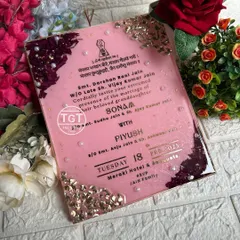 An angled view showing the glossy finish and the texture of the preserved petals and stones. This is an invitation that doubles as a piece of art.
