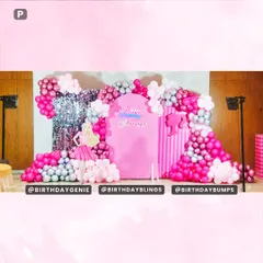 A full view of the Barbie setup, showing the organic balloon arch framing the central decor, complete with a Barbie silhouette and neon birthday sign.