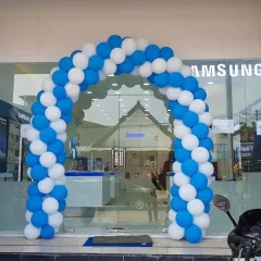 A classic balloon arch is a proven way to announce a new store. For this Samsung showroom, I created a simple yet effective arch using their brand colors, blue and white, to draw attention from the street.
