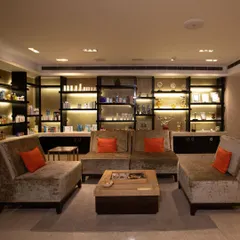 Another perspective of our client lounge, showcasing the warm, inviting ambiance we cultivate. It’s the perfect setting to begin your journey of relaxation and transformation with us.