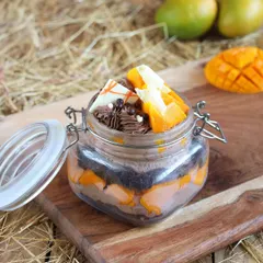 My Mango Jar Cake is a portable delight. I layer fresh mango chunks with light cake and creamy mousse in a convenient jar, making it a perfect single-serving treat to enjoy anywhere.