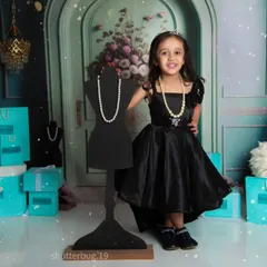 A little fashionista posing proudly in our "Tiffany & Co." inspired theme, complete with iconic blue bags and pearls.