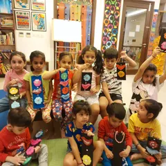 My toddler class working on and proudly displaying their ethnic wall hangings made from clay and wood. They love working with different materials and creating something they can take home.