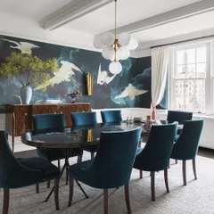 A dining room becomes a scene of dramatic poetry with this large-scale mural. Featuring graceful cranes against a deep, atmospheric sky, this wallcovering turns every meal into an elegant and memorable occasion.