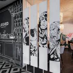 We love creating strongly themed environments, like this sketch-inspired cafe. The entire space, from the furniture to the walls, is designed to feel like stepping into a two-dimensional, monochromatic illustration, offering a truly unique and immersive experience.