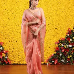 The graceful drape of the organza fabric is captured in this beautiful shot, perfect for a wedding guest or bridesmaid.