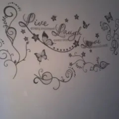 Your favorite words can become part of your home decor. I do custom stencil work like this "Live, Laugh, Love" design, complete with elegant swirls and butterflies, to give your walls a personal and inspiring message.