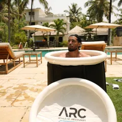 An athlete takes a well-deserved ice bath at our Goa camp. This recovery method is a critical part of our program, helping to reduce muscle soreness and speed up recovery after intense training.