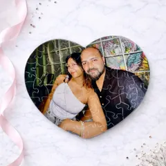 A completed heart-shaped photo puzzle, showing a lovely couple. It's a thoughtful and interactive gift for an anniversary or birthday.